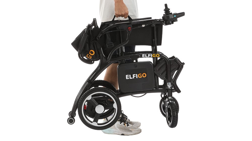 Lightweight foldable electric wheelchair being carried on one hand
